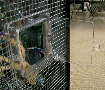 Hinged Door connected to the wire on an aviary